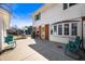 Spacious backyard patio with outdoor seating, adjacent to a well-maintained white home at 229 W Taylor St, Pendleton, IN 46064