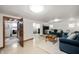 Basement living room with a comfortable couch, TV, and laundry room, adding extra living space at 229 W Taylor St, Pendleton, IN 46064