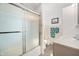 Bright bathroom featuring a glass-enclosed shower, modern vanity, and tasteful decor at 229 W Taylor St, Pendleton, IN 46064