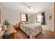 Bright bedroom with ample natural light, complemented by a wicker dresser, creating a relaxing space at 229 W Taylor St, Pendleton, IN 46064