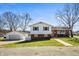 Charming two-story home with a well-maintained lawn, brick accents, detached garage, and inviting curb appeal at 229 W Taylor St, Pendleton, IN 46064