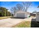 Detached one-car garage with basketball hoop and a concrete driveway at 229 W Taylor St, Pendleton, IN 46064