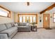 Comfortable living room featuring a large sectional sofa, natural light, and a cozy ambiance at 229 W Taylor St, Pendleton, IN 46064