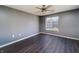 Cozy bedroom featuring a ceiling fan and large window, offering ample natural light and ventilation at 240 Legends Creek # 206, Indianapolis, IN 46229