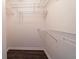 Walk-in closet with sturdy wire shelving and dark wood floor at 240 Legends Creek # 206, Indianapolis, IN 46229