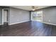 Bright living room featuring stylish flooring and sliding glass door to balcony, creating an inviting atmosphere at 240 Legends Creek # 206, Indianapolis, IN 46229