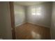 Bedroom with a window letting in natural light and hardwood floors throughout at 260 W 33Rd St, Indianapolis, IN 46208