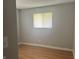 Bedroom with a window letting in natural light and hardwood floors throughout at 260 W 33Rd St, Indianapolis, IN 46208