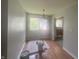 Dining room featuring hardwood floors, natural lighting, and a hanging light fixture at 260 W 33Rd St, Indianapolis, IN 46208