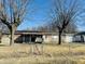 A single-story brick home with a covered front porch and mature trees at 260 W 33Rd St, Indianapolis, IN 46208