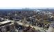 An aerial view capturing the neighborhood with charming homes, mature trees, and distant city skyline at 2839 E 19Th St, Indianapolis, IN 46218