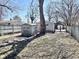 Backyard with a metal storage shed, tree, and patchy lawn on a sunny day at 2839 E 19Th St, Indianapolis, IN 46218