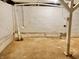 Basement featuring concrete floor, a support beam, and a sump pump at 2839 E 19Th St, Indianapolis, IN 46218