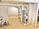 Basement with utility pipes, support beams, and a water heater at 2839 E 19Th St, Indianapolis, IN 46218