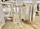 Basement featuring utility pipes, concrete floor, and white brick walls at 2839 E 19Th St, Indianapolis, IN 46218