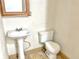 Bathroom featuring a pedestal sink and toilet at 2839 E 19Th St, Indianapolis, IN 46218