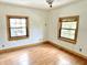 Bright bedroom features wood-look flooring and natural light from two windows at 2839 E 19Th St, Indianapolis, IN 46218