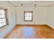 Bedroom featuring wood floors and a window with wood trim at 2839 E 19Th St, Indianapolis, IN 46218