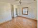 Empty bedroom with hardwood floors and natural light from the window at 2839 E 19Th St, Indianapolis, IN 46218