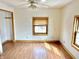 Bedroom showcasing wood-look floors, ceiling fan and natural light from window at 2839 E 19Th St, Indianapolis, IN 46218