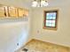 Dining room area with wooden cabinets and a window at 2839 E 19Th St, Indianapolis, IN 46218