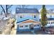 Charming two-story home featuring light blue siding, wood accents, and well-maintained landscaping at 2839 E 19Th St, Indianapolis, IN 46218