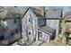 Two-story home featuring light gray siding, a dark gray roof, and a small, fenced-in backyard at 2839 E 19Th St, Indianapolis, IN 46218