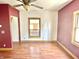 Living room featuring wood-look flooring, natural wood trim and window view at 2839 E 19Th St, Indianapolis, IN 46218
