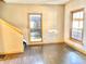 Cozy living room featuring wood flooring, a window and natural wood trim at 2839 E 19Th St, Indianapolis, IN 46218