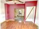 Living room with hardwood floors leading to hallway and other rooms at 2839 E 19Th St, Indianapolis, IN 46218