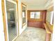 Bright sunroom featuring brick accents, wood framed windows, and an abundance of natural light at 2839 E 19Th St, Indianapolis, IN 46218