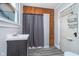 Bathroom with modern vanity, mirror, and window above at 300 S Market St, Thorntown, IN 46071