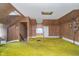 Bedroom features carpeted floor, wooden walls, a window, and sloped ceilings at 300 S Market St, Thorntown, IN 46071