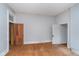 Empty bedroom features hardwood floors, neutral paint, and good natural light at 300 S Market St, Thorntown, IN 46071