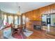 Inviting dining room showcases a brick fireplace and sunlit bay windows at 300 S Market St, Thorntown, IN 46071