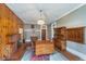 Comfortable dining room with fireplace, wood furniture, and period details at 300 S Market St, Thorntown, IN 46071
