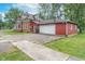 Charming home with attached garage, long driveway, and mature trees adding to the property's appeal at 300 S Market St, Thorntown, IN 46071