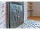Elaborate fireplace features intricate relief details on the metal cover at 300 S Market St, Thorntown, IN 46071