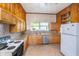Bright kitchen featuring stone countertops, modern appliances, and ample cabinet space at 300 S Market St, Thorntown, IN 46071