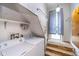 Functional laundry area with washer, dryer, and storage under the stairs at 300 S Market St, Thorntown, IN 46071