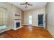Living room features hardwood floors, a fireplace, and built in shelving at 300 S Market St, Thorntown, IN 46071