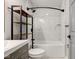 Bright bathroom with a tiled shower, storage shelves, a gray vanity and a new toilet at 301 Villa Ave, Indianapolis, IN 46201
