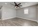 Spacious bedroom features a contemporary ceiling fan, neutral walls, and modern flooring at 301 Villa Ave, Indianapolis, IN 46201