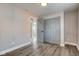 Gray bedroom featuring wood-look flooring and a double door closet at 301 Villa Ave, Indianapolis, IN 46201