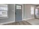 Welcoming entryway with stylish gray door, ample natural light, and modern flooring at 301 Villa Ave, Indianapolis, IN 46201