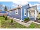 Charming blue home showcasing its exterior elevation with a landscaped front yard at 301 Villa Ave, Indianapolis, IN 46201