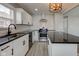 Well-equipped kitchen with sleek countertops, modern appliances, and ample cabinet space for storage at 301 Villa Ave, Indianapolis, IN 46201
