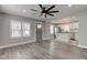 Open-concept living area with gray flooring, light-filled windows, and a seamless transition to the modern kitchen at 301 Villa Ave, Indianapolis, IN 46201