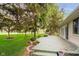 Wooden backyard deck overlooking the lush green grass and beautiful trees at 3034 Tiffany Ct, Carmel, IN 46033