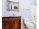 Elegant bathroom featuring marble vanity, decorative mirror, toilet, and shower at 3034 Tiffany Ct, Carmel, IN 46033